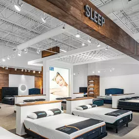 Rooms To Go mattress gallery featuring premium bedding options.