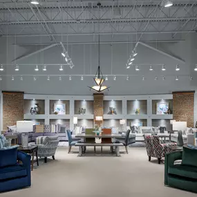 Elegant seating area display at Rooms To Go Pearland, TX, featuring stylish chairs and sofas.