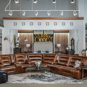 Living room furniture setup with premium leather seating.