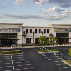 Front view of RTG Kids & Patio showroom with spacious parking lot.