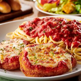 Chicken Parmigiana: A classic with our homemade marinara and a side of spaghetti.