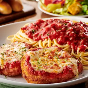 Chicken Parmigiana: A classic with our homemade marinara and a side of spaghetti.