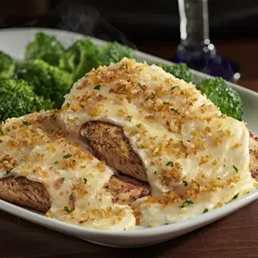 Order our Parmesan Crusted Chicken made with grilled chicken topped with a creamy Parmesan and garlic cheese crust.