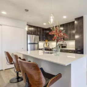 Kitchen with Stainless steel appliances, Quartz countertops, and Soft-close cabinets