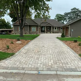 Upgrade your driveway with Richbergs Landscape's premium pavers. Elevate your home's exterior with durability and style. Contact us today to discuss your project!