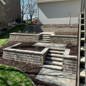 Transform your slopes into stunning focal points with Richbergs Landscape's custom retaining walls. Let's create a landscape that's as beautiful as it is functional. Reach out today for a consultation!