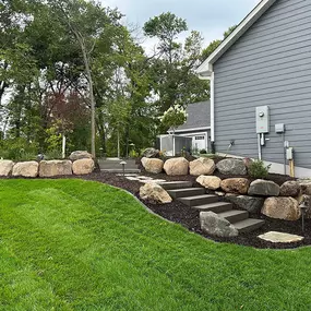 Elevate your outdoor oasis with Richbergs Landscape's custom retaining walls. Let's create a backdrop that enhances your landscape's beauty and functionality. Connect with us now to get started.