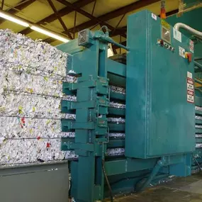 Absolute Data Shredding's shredded paper baling machine. We provide NAID AAA Certified paper shredding, hard drive destruction, and electronics recycling services in Oklahoma City and Tulsa, OK.