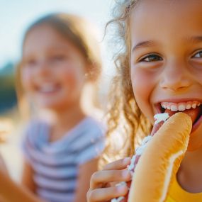 Kids smile when eating our hot dogs in Denville