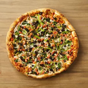 VEGGIE DELUXE PIZZA Onions, green peppers, mushrooms, fresh spinach, diced tomatoes, green & black olives.