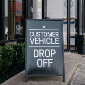 Clutch Automotive Friendswood customer vehicle drop-off sign