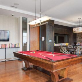 Clubroom and game room with pool table and seating.