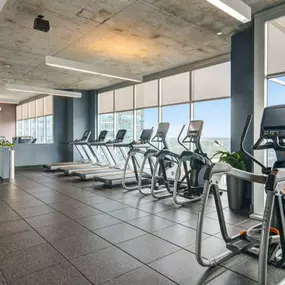 24 hour fitness center with ample cardio machines.