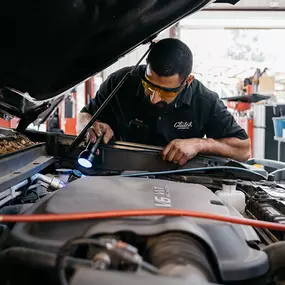 car mechanic checking car hood