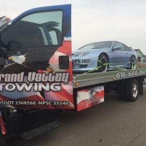 Don’t Let Car Trouble Get You Down

Count on our towing experts in Grandville, Hudsonville & Grand Rapids, MI to help you out
You can’t drive your vehicle. Maybe you have a flat tire. Perhaps you’ve been in an accident. In any case, you can count on Grand Valley Towing LLC of Grandville, MI and Grand Rapids,MI to retrieve your vehicle or help you get it running again. We service all of Grandville, Hudsonville & Grand Rapids, MI!

We offer roadside assistance 24 hours a day and towing services to
