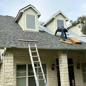 Photo of our roofing crew laying field shingles.