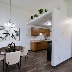 an open kitchen and dining room with a table and chairs