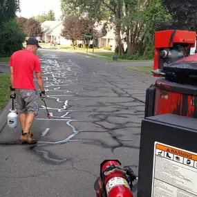 The Client, a management company for a 55+ Community in Bloomfield, wanted 25,000 linear ft cracks filled.
