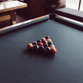 a pool table with billiard balls on it