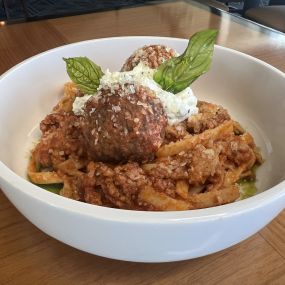 Sunday Gravy made with artisan meatballs, 4-hour bolognaise, tagliatelle pasta, EVOO and fresh basil.