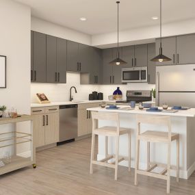 Apartment interior featuring chef-style kitchens with kitchen island, stainless steel appliances, dual-tone cabinetry and pendant lighting at The MARC luxury apartments in Palm Beach Gardens, FL