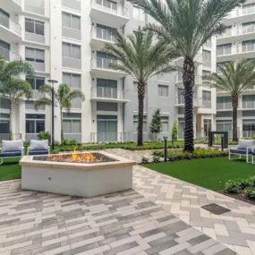 Outdoor Fireside Seating at The Marc Luxury Apartments in Palm Beach Gardens FL