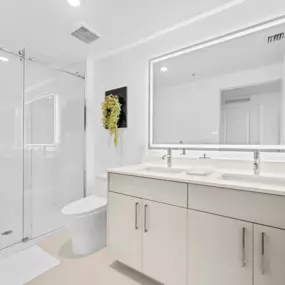 Elegant Bathrooms with LED Mirrors at Vista Sur luxury apartments in Naranja, FL