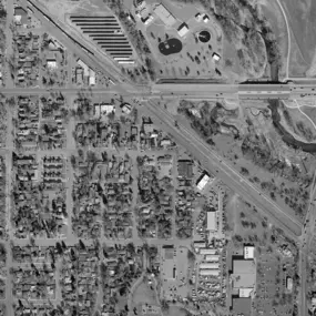 This black-and-white aerial photo of Colorado, captured by Synergy Mapping, provides valuable data for the Architecture & Urban Planning industry, aiding in urban analysis, planning, and development through detailed imagery.