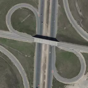 This medium-format aerial image of Colorado roadways, captured by Synergy Mapping, Inc., provides key data for the Infrastructure Development industry. Their medium-format photography services aid in precise analysis.