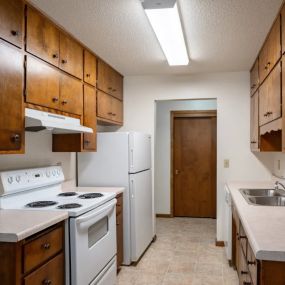 a kitchen with white appliances