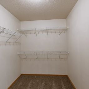 a closet with three shelves