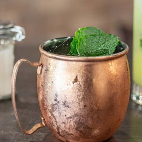 Drinks served in copper cup at Holden Oversoul Kitchen & Oyster Bar