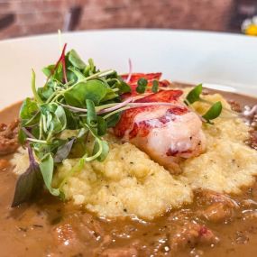 lobster and grits plated.