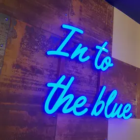 Zizzi Chatham, Neon sign saying 'In to the blue'.