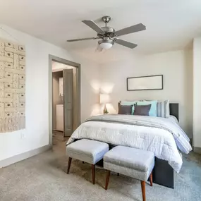 The bedroom at TwentyOne 01 on Market apartments offers comfort and modern touches.
