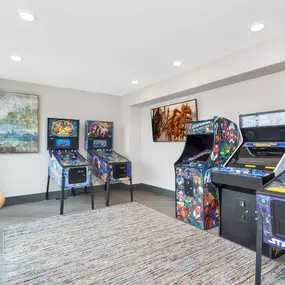 The game room at Westwood Green Apartments offers fun and entertainment with classic pinball and arcade machines.