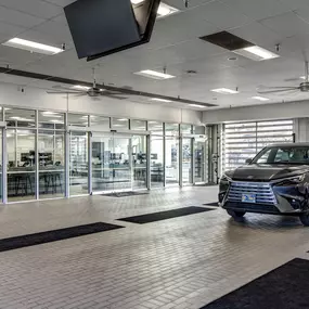 A Lexus vehicle in the service center driveway