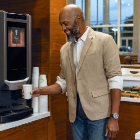 A customer getting a drink in the service waiting area