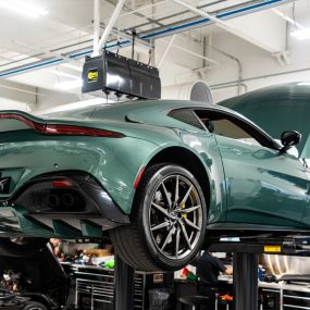 A Bentley up on a service lift