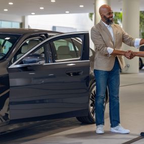 A service technician shaking hands with a customer