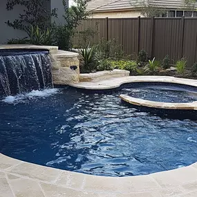 Pool, spa and waterfall perfect for a small backyard