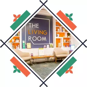 Lobby of The Living Room Dispensary in Maryland with seating, decorative shelves, and a bold sign.