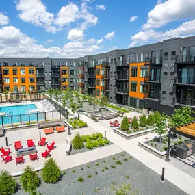 Beautiful aerial view of the building, swimming pool, and outdoor area