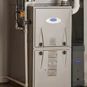 Install photos of a brand new Carrier high-efficiency 2 stage furnace, known for being reliable, eco-friendly, and ENERGY STAR certified.