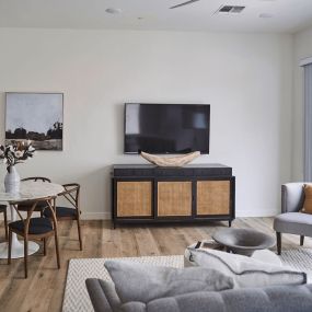 a living room with a couch and a table and a television