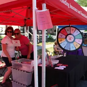 The Denise Dombach State Farm team out with the wheel!