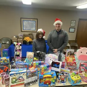 Agent Chester Lewis and team member Denise Dixion delivering Christmas donations to Heavenly Smiles Charity of Chelsea, AL. Heavenly Smiles assists needy families in Chelsea and Shelby County with Christmas gifts and food donations. Merry Christmas