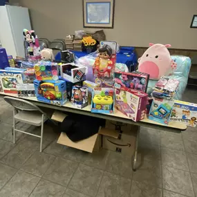 Agent Chester Lewis and team member Denise Dixion delivering Christmas donations to Heavenly Smiles Charity of Chelsea, AL. Heavenly Smiles assists needy families in Chelsea and Shelby County with Christmas gifts and food donations. Merry Christmas