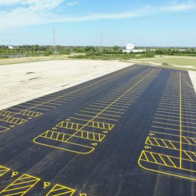 Parking lot that has been freshly repaved and restriped.