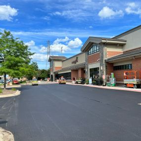 Parking lot that looks like it has been freshly repaved.